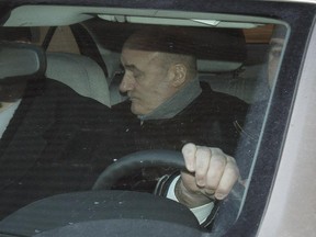 Ian Bush is escorted out of the Ottawa Courthouse on February 20, 2015.