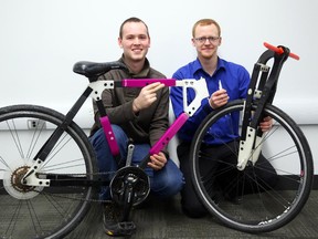 James Nugent (L) and Michael Mackay-MacLaren  are second-year students in Carleton University's Faculty of Engineering and Design that are trying to build a functional bike from 3D printed parts.  (Jean Levac/ Ottawa Citizen)