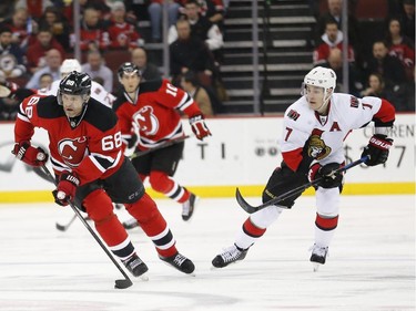 New Jersey Devils right wing Jaromir Jagr (68), of the Czech Republic, skates with the puck as Ottawa Senators center Kyle Turris (7) trails during the second period.