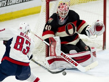 Ottawa Senators goalie Robin Lehner makes a save on Washington Capitals center Jay Beagle during second period NHL action.