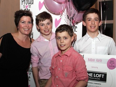 Jenn Graves with fellow volunteers Ben Phillips, Tyler Cutts and Connor Lockhart, all 12, at the Proud to be Bully Free dinner in support of youth empowerment and acceptance, held at NeXT restaurant on Monday, February 23, 2015.