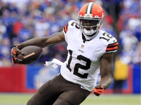 In this Nov. 30, 2014, file photo, Cleveland Browns wide receiver Josh Gordon carries the ball after a reception against the Buffalo Bills