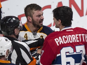 Buffalo Sabres' Josh Gorges confronts his old teammate Montreal Canadiens' Max Pacioretty.