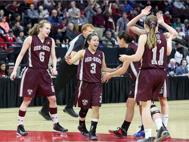 Krista Van Slingerland, left, Julia Soriano (3) and other members of the University of Ottawa team celebrate their victory.