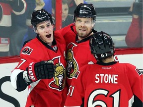 The Ottawa Senators' Kyle Turris (7) celebrates his goal with teammates Milan Michalek and Mark Stone (61) during first period NHL hockey action against the Florida Panthers in Ottawa on Saturday, Feb. 21, 2015.