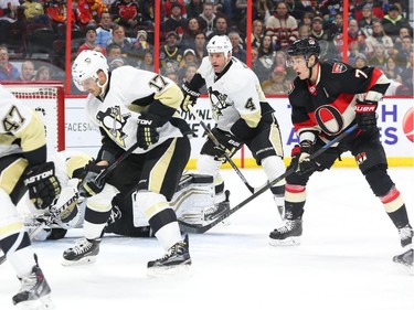 Kyle Turris of the Ottawa Senators is surrounded by a great defensive line by the Pittsburgh Penguins during first period of NHL action at Canadian Tire Centre in Ottawa, February 12, 2015.