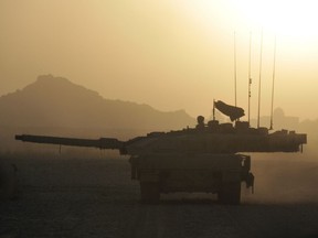 English/Anglais
IS2010-3030-28 
15 October 2010
Panjwa'i District, Afghanistan

A Leopard 2A6M Main Battle Tank from The Lord Strathcona’s Horse (Royal Canadians) and part of the 1st Battalion, The Royal Canadian Regiment Battle Group, provides over-watch during recent operations in the volatile Panjwa’i and Zhari Districts of Kandahar Province. The sheer size and firepower of the Leopard 2A6M Main Battle Tank makes it a formidable force and a huge deterrent to enemy insurgents. 

In close cooperation with Afghan National Security Forces, 1st Battalion, The Royal Canadian Regiment Battle Group provides security by conducting counter-insurgency operations throughout Panjwa’i District located south-west of Kandahar City. The Battle Group conducts partnered operations with the 2nd Kandak of the 1st Brigade, 205 Corps of the Afghan National Army, Afghan National Police and the Panjwa’i District Governor in order to advance governance, reconstruction and security in the area.

Operation ATHENA is Canada’