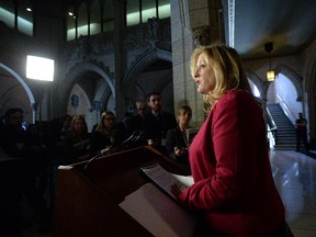 Minister of Transport Lisa Raitt speaks during a press conference in the foyer of the House of Commons on rail transportation safety.