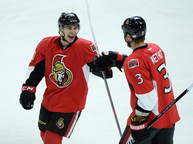 Ottawa Senators' Shane Prince, left, celebrates his first NHL assist with teammate Marc Methot.