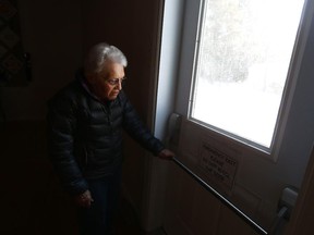 Mary Dashney is the caretaker of St. Mary's Church stands by the door that was broken into by thieves.