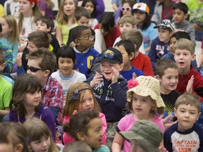 Matthew Deugo - Johnston (centre) got into the upbeat spirit of the event, clapping and singing along.at John Young Elementary School in Kanata.