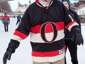 Mayor Jim Watson (C) skates on the canal for the very first time as he challenges himself to learn how to skate with the help of Melissa Lambert (L) and skating coach Nathalie Roy (R) from the Gloucester skating club. Assignment - 119778 Photo taken at 10:17 on February 10. (Wayne Cuddington/Ottawa Citizen)