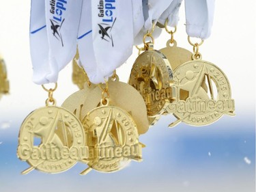 Medals not yet awarded hang on a hook during the Gatineau Loppet in Gatineau, Saturday, February 14, 2015. Competitors braved falling snow plus bone-chilling temperatures to participate in today's event, which started at 9am.