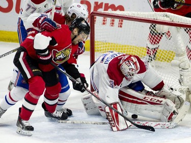 Ottawa Senators left wing Milan Michalek puts the puck past Montreal Canadiens goalie Dustin Tokarski under pressure from defenseman Nathan Beaulieu during second period NHL action.