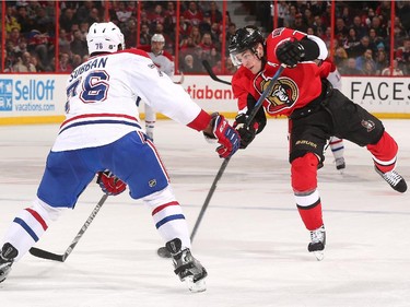 Kyle Turris #7 of the Ottawa Senators shoots the puck against P.K. Subban #76 of the Montreal Canadiens.