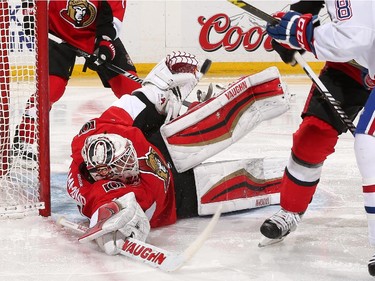 OTTAWA, ON - FEBRUARY 18: Andrew Hammond #30 of the Ottawa Senators stacks the pads to make a save on a scoring chance by the Montreal Canadiens at Canadian Tire Centre on February 18, 2015 in Ottawa, Ontario, Canada.