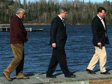 2007: North Shore MP Joe Comuzzi, left, walks the Nipigon Marina with Environment Minister John Baird and Prime Minister Stephen Harper after the federal government announced a National Marine Conservation Area for Lake Superior , October 25, 2007.