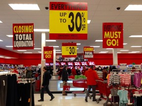 Dealhunters at the Billings Bridge Target store Thursday as the liquidation process begins.