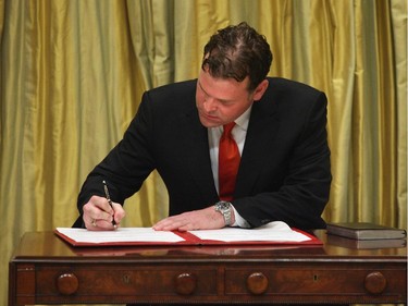 2006: The Hon. John Baird, signs the book after being sworn-in as President of the Treasury Board, February 6, 2006.