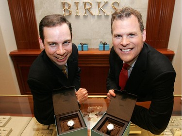 2006: Alex Munter and John Baird hold out their Birks' signature automatic watches which were awarded to the two for placing first (Baird) and second (Munter) in Ottawa Life Magazine's annual Top 50 people in the Capital, April 10, 2006. Birks donated watches to the top ten people in the Capital.