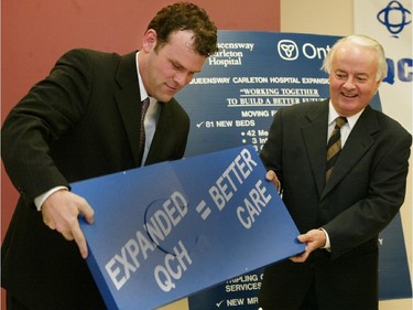 2002: Norm Sterling, right, announced with MPP John Baird, an additional $22M for the Queensway-Carleton Hospital, December 20, 2002.