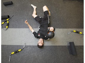 Ottawa Fury's Drew Beckie grits his teeth during fitness testing on the first day of training camp at TD Place Monday.
