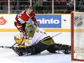 Dante Salituro of the Ottawa 67's watches his shot get past Jake Smith of the North Bay Battalion for a goal during OHL action at TD Place on Sunday, Feb. 08, 2015. Salituro had two goals and three assists in the game.