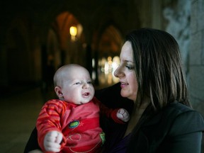 NDP MP Sana Hassainia poses for a photograph with her three month old baby Skander-Jack Kochlef on Parliament Hill in Ottawa, Ont., Feb. 8, 2012