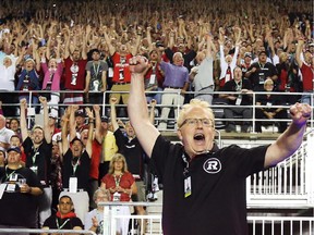 Ottawa Redblacks's co-owner Jeff Hunt celebrates his team's first win at the franchise home opener against the Toronto Argonauts at TD Place in Ottawa, July 18, 2014.