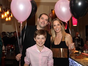 Ottawa Senators player Chris Phillips with his wife, Erin, and their eldest, Ben, 12, a volunteer at the 4th annual Proud to be Bully Free benefit dinner for youth empowerment held at NeXT restaurant on Monday, February 23, 2015.