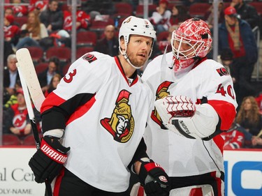 Robin Lehner #40 of the Ottawa Senators talks during a timeout with teammate Marc Methot #3.