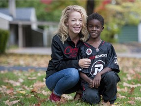 Peggy Taillon and her son Devlin, 7, are photographed at their home in Ottawa on Sunday, October 5, 2014.