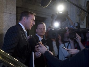 Justice Minister Peter MacKay speaks with the media Friday.