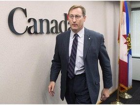 Justice Minister Peter MacKay heads from a news conference, regarding a foiled mass murder plan, in Halifax on Saturday, Feb. 14, 2015. MacKay said the plot to carry out the killings in a public place was not linked to terrorism. Three people have been arrested.