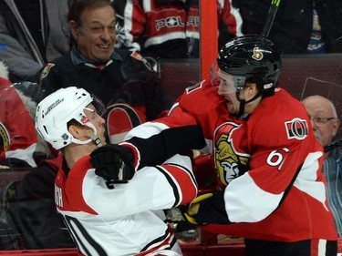 Fans react to a hit between Ottawa Senators' Mark Stone and Carolina Hurricanes' Riley Nash during first period NHL hockey action.