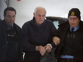 Robert Edgar arrives at the courthouse in L'Orignal, Monday, February 2, 2015. Edgar, pictured outside an OPP police vehicle, is charged with murdering his wife Zdenka (Radja) Sekora at their home in Lefaivre. Mike Carroccetto / Ottawa Citizen