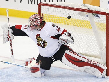 A shot by New Jersey Devils left wing Mike Cammalleri, not pictured, enters the net of Ottawa Senators goalie Robin Lehner, of Sweden, for a goal during the third period.