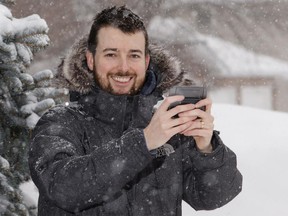 Rolf Campbell runs the YOW_Weather twitter account that updates followers with weather news in Ottawa on February 21, 2015. (Jana Chytilova / Ottawa Citizen)  ORG XMIT: 0221 Twitter JC07