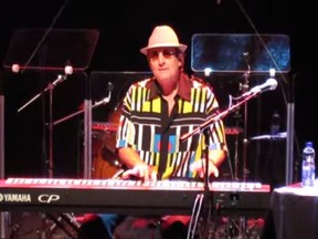 David Maxwell on stage at Bluesfest in Ottawa, in a screen capture from a fan video.