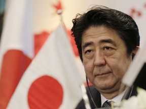 In this Jan. 17, 2015 file photo, Japanese Prime Minister Shinzo Abe attends a joint meeting of the Japan-Egypt business committee in Cairo, Egypt.