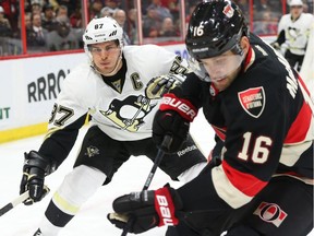 Sidney Crosby of the Pittsburgh Penguins in the offensive zone agains Clarke MacArthur of the Ottawa Senators during second period of NHL action at Canadian Tire Centre in Ottawa, February 12, 2015.