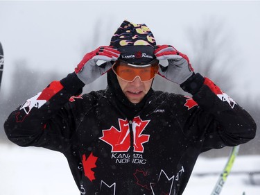 Skier Alexei Novikov (4020) adjusts his goggles prior to the start of  the Gatineau Loppet in Gatineau, Saturday, February 14, 2015. Competitors braved falling snow plus bone-chilling temperatures to participate in today's event, which started at 9am.