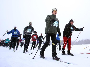 Skiers at the beginning of the Gatineau Loppet in Gatineau, Saturday, February 14, 2015. Competitors braved falling snow plus bone-chilling temperatures to participate in today's event, which started at 9am.