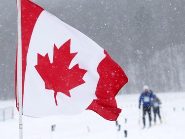 Skiers head toward a water station during the Gatineau Loppet in Gatineau, Saturday, February 14, 2015. Competitors braved falling snow plus bone-chilling temperatures to participate in today's event, which started at 9am.