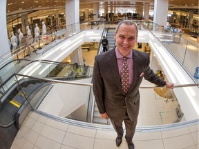Store manger John Banks greets reporters on Thursday near the wide open escalators as Nordstrom Rideau Centre held a media preview day in advance of the grand opening on March 6.