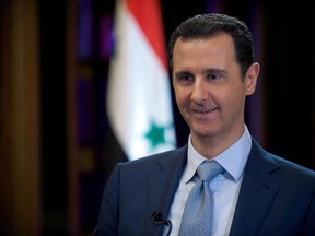 A handout picture dated February 8, 2015, and released by the Syrian Arab News Agency (SANA) on February 10, 2015 shows Syrian President Bashar al-Assad (R) giving an interview to the BBC's Middle East Editor in Damascus.