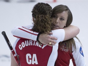 Team Canada skip Rachel Homan, right hugs second Joanne Courtney after winning the bronze medal game.