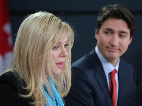 The Leader of the Liberal Party of Canada, Justin Trudeau,  (R) holds a press conference to announce former Conservative Party M.P. Eve Adams (L) has crossed the floor and joined the Liberals.