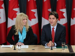 The Leader of the Liberal Party of Canada, Justin Trudeau,  (R) holds a press conference to announce former Conservative Party M.P. Eve Adams (L) has crossed the floor and joined the Liberals. Assignment - 119769 Photo taken at 09:37 on February 9. (Wayne Cuddington/Ottawa Citizen)