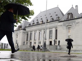 The Supreme Court of Canada building is pictured in Ottawa on Wednesday October 15, 2014. The Supreme Court of Canada will decide Thursday whether to hear Hassan Diab's appeal and — if so — forestall his extradition to France to face questions about the 1980 bombing of a Paris synagogue. THE CANADIAN PRESS/Sean Kilpatrick   // 1122 justice supreme